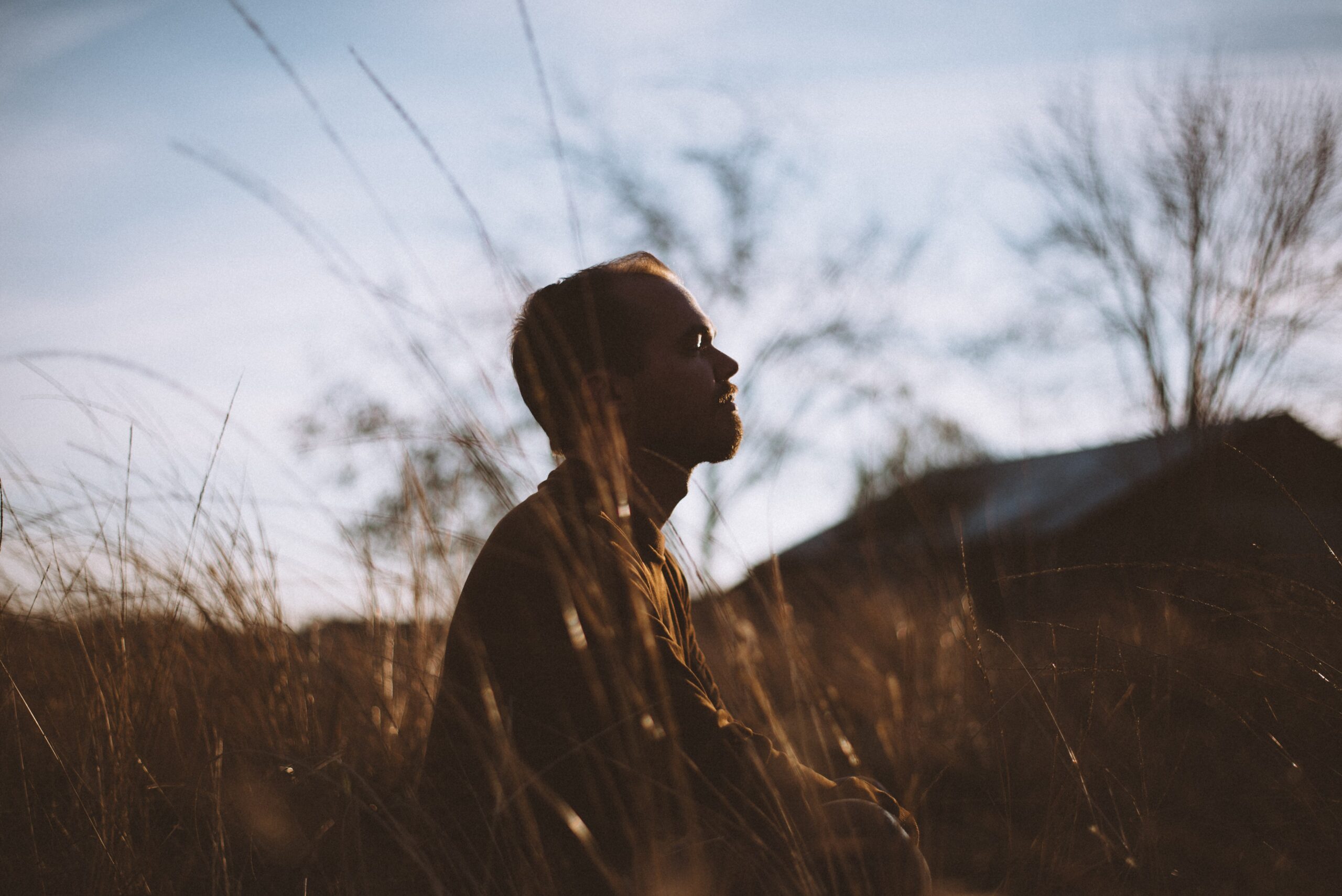 man in the nature sitting and relaxing stock photo